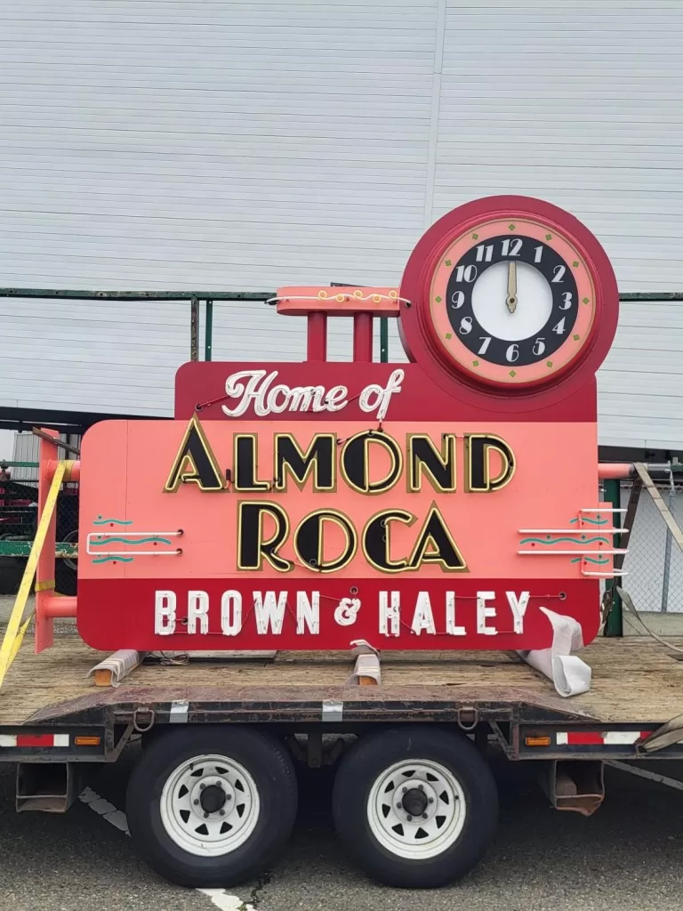 A red sign with a clock reads "Home of Almond Roca, Brown & Haley," proudly displayed on a trailer, capturing the attention of Almond Roca enthusiasts from Seattle and beyond. As reported by King 5, it's a tribute to the beloved confectionery that has delighted taste buds for generations.